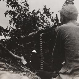Seated Man At Gun