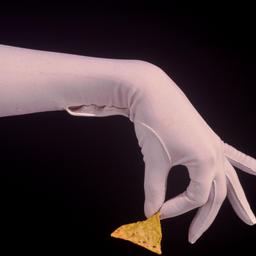 Gloved hand holding chip.