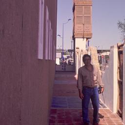 Exterior view, man walking ...