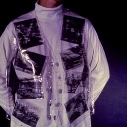 Woman wearing plastic vest ...