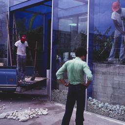 Workers placing rocks, seen...