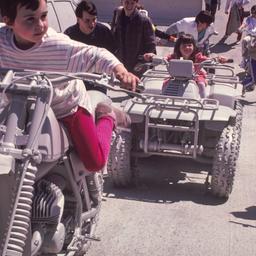 Children riding gray motorc...