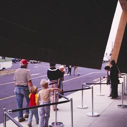 Exterior view, people enter...