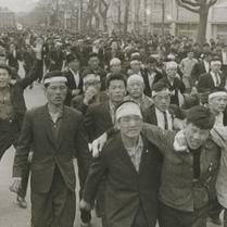 Students marching in the st...