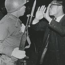 A man dressed in a black su...