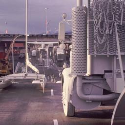 Gray vehicles on undulating...