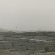 Wide open fields and cars r...