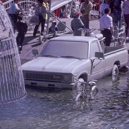 Gray pickup truck and bicyl...
