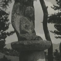 A seated stone Buddha locat...