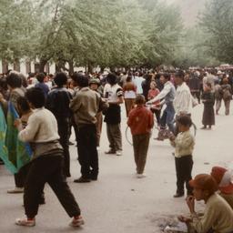 Two Tibetan boys sitting on...