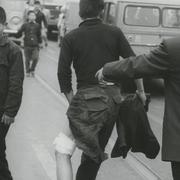 Wounded, barefoot protestor...