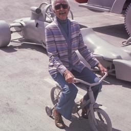 Woman riding small, white b...