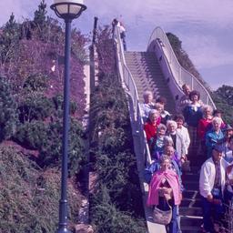 Visitors posed on landscape...