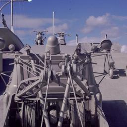 Gray vehicles on undulating...