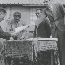 Ted Conant handing gift to ...