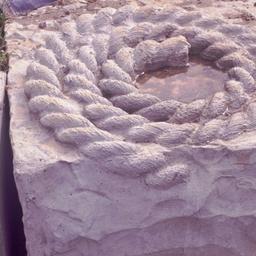 Rope inmedded in stone.