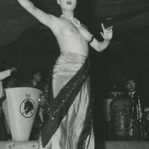 A topless Korean female dan...