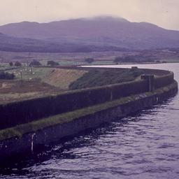 Retaining wall along water.