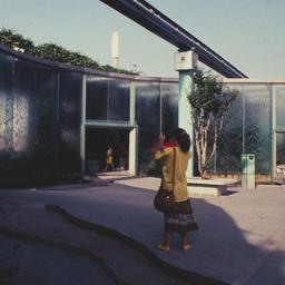 Exterior view, woman photog...