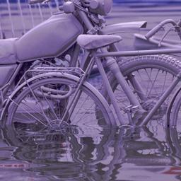 Gray motorbike and bicyles ...