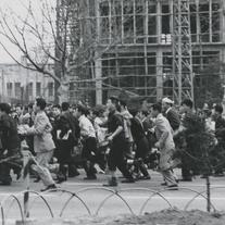 Protestors running away in ...