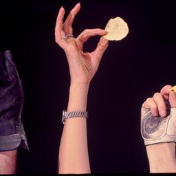 Hands holding chips.