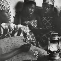 Young Muslim woman learning...