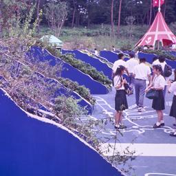 Visitors near vertical plan...