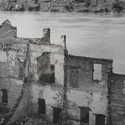 Burned Buildings By River L...