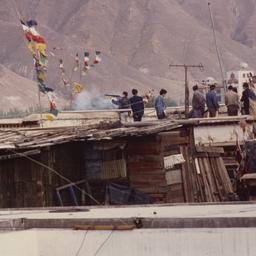 Plain clothes police firing...