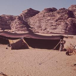 Tent with rock formation in...