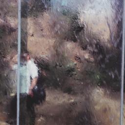 Man seen through waterfall ...