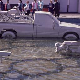Gray pickup truck and bicyl...