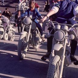 Children riding gray motorb...
