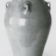 A ceramic vase with 4 mini ...