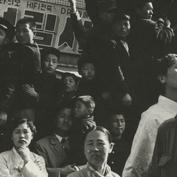 Crowd of demonstrators sitt...