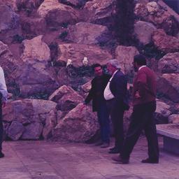 Men on promenade, talking n...
