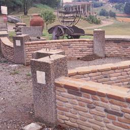 Wall with garden pavilion i...