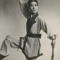 A male dressed in costume i...
