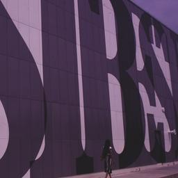 Exterior view, woman walkin...