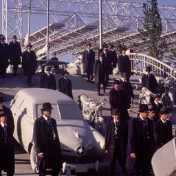 Men in dark hats and coats ...