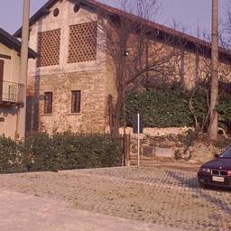 Exterior view, house and barn.