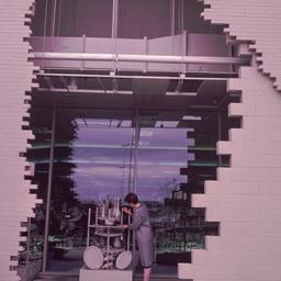 Exterior view, woman viewin...