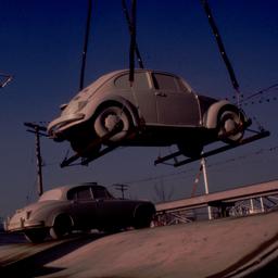 Gray Volkswagen beetle bein...