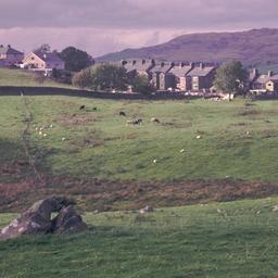 Rowhouses behind field with...