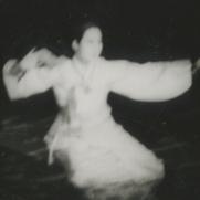 A female dancer wearing a w...