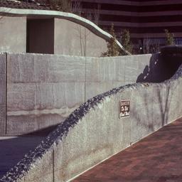 Undulating concrete wall ne...