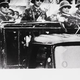 Soldiers on top of truck wi...