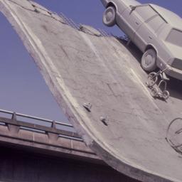 Gray vehicles at end of und...