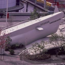Gray submarine rising onto ...